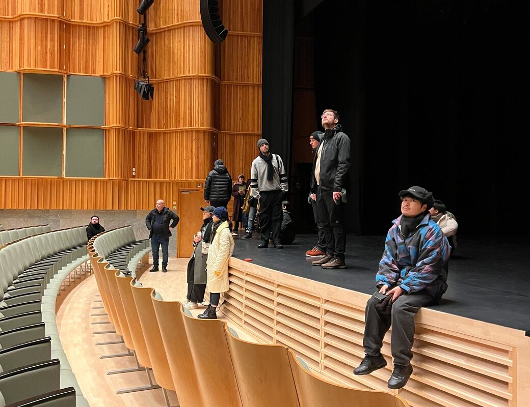 Students on the stage of Kuhmotalo
