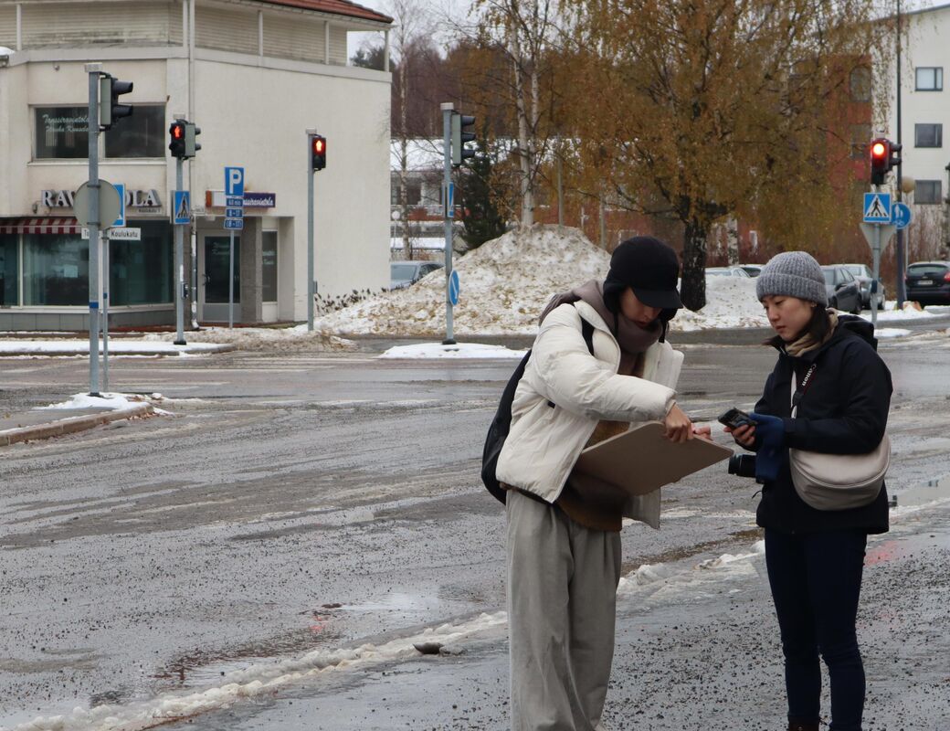 Students measuring surroundings