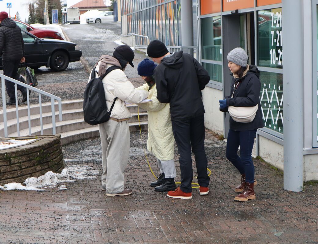 Students measuring the site