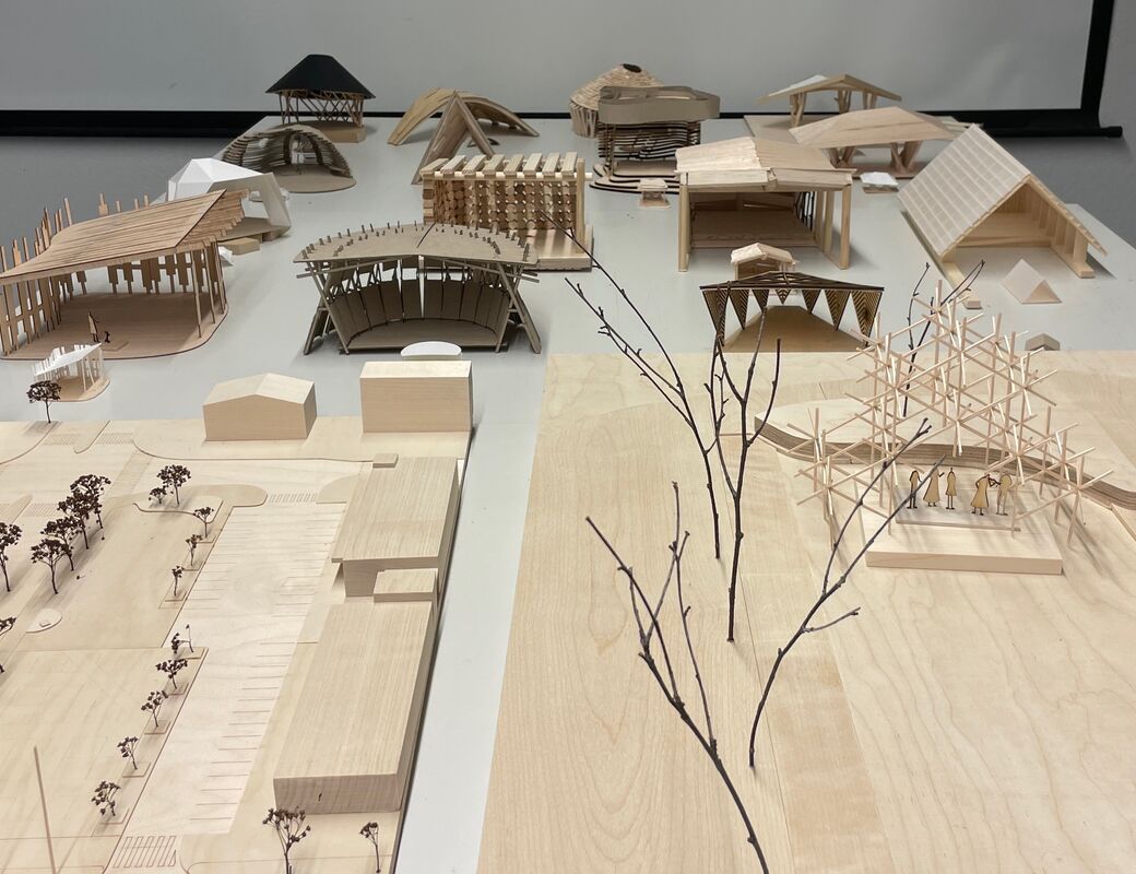 Photo of 1 to 50 scale models of all 17 proposals for the stage