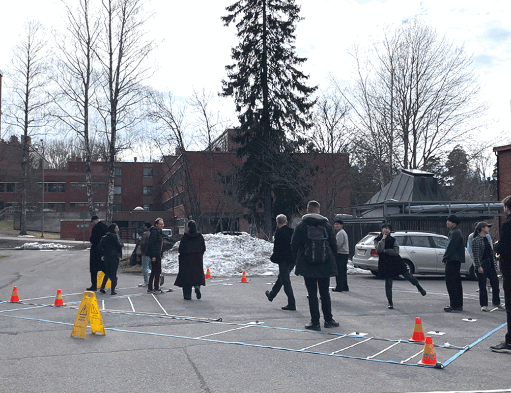 Moving image of students walking around the stage mockup and posing for camera