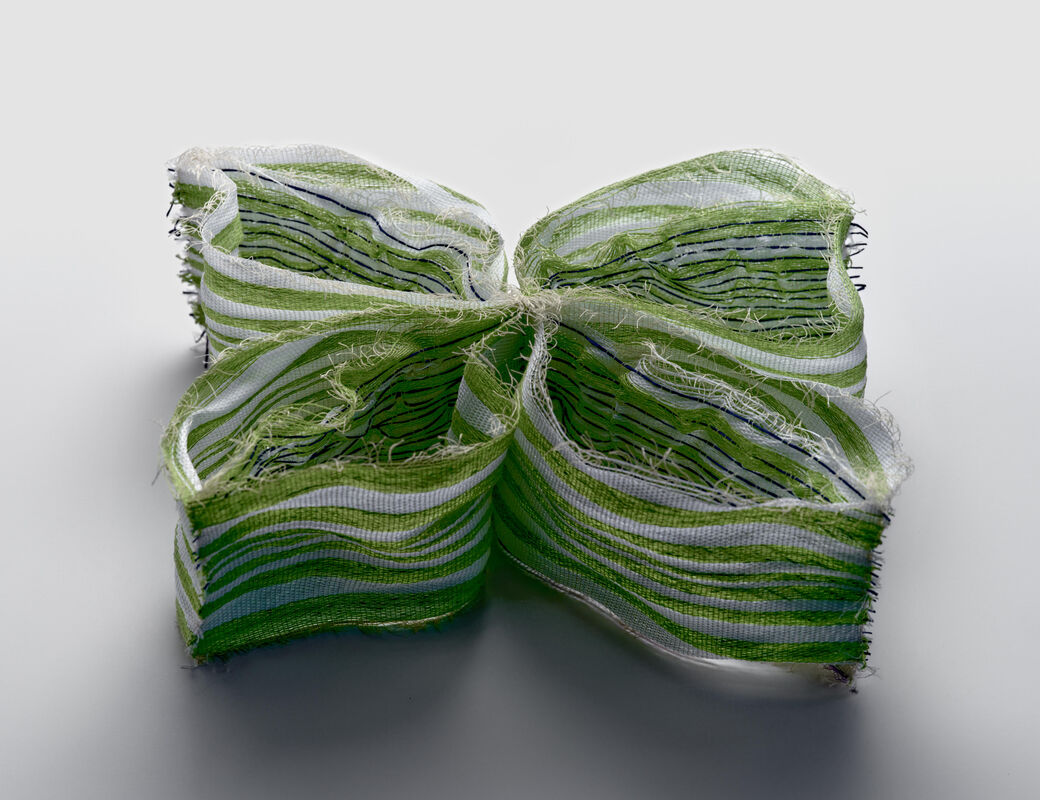 A light-reactive textile sample part of Entangled exhibition in Designs for a Cooler Planet 2024.