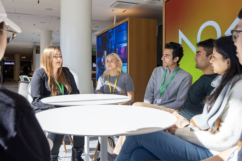 Group of people sitting around a table.