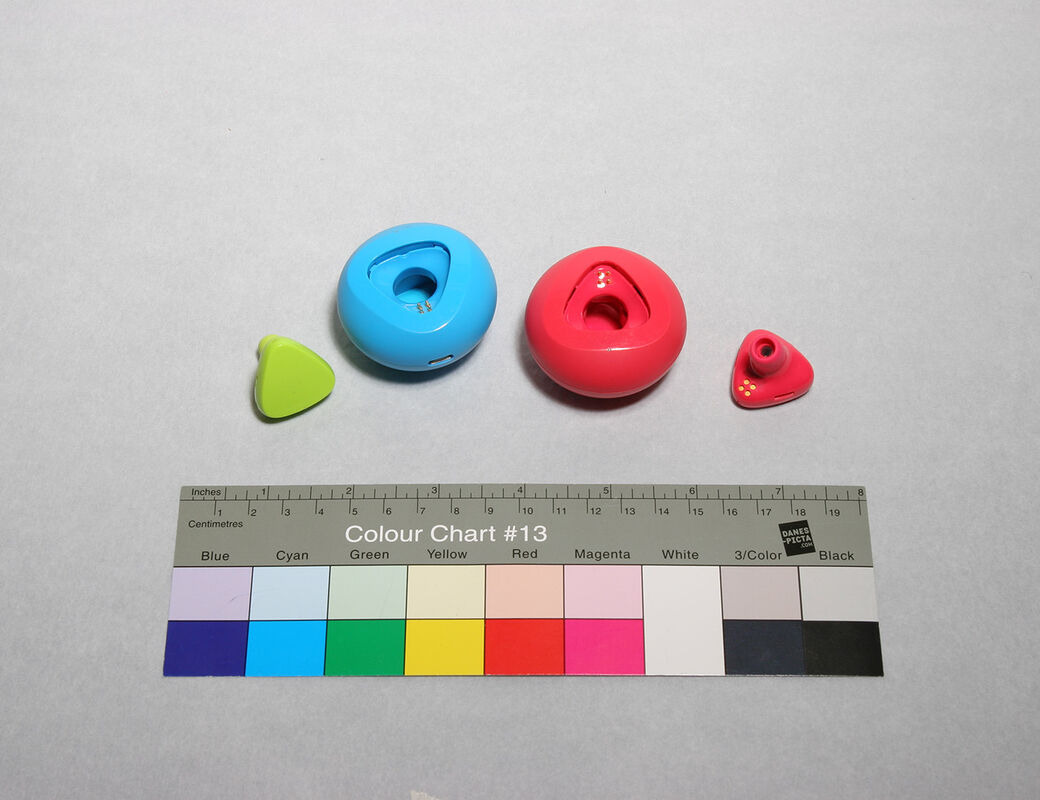 Red, blue and green model for earbuds and charging docks.