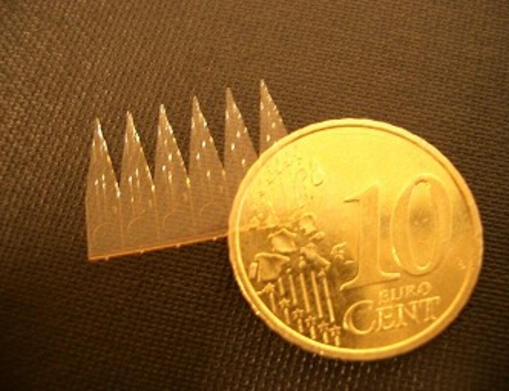CHEM_Microfabrication group_SU-8 ESI array with coin