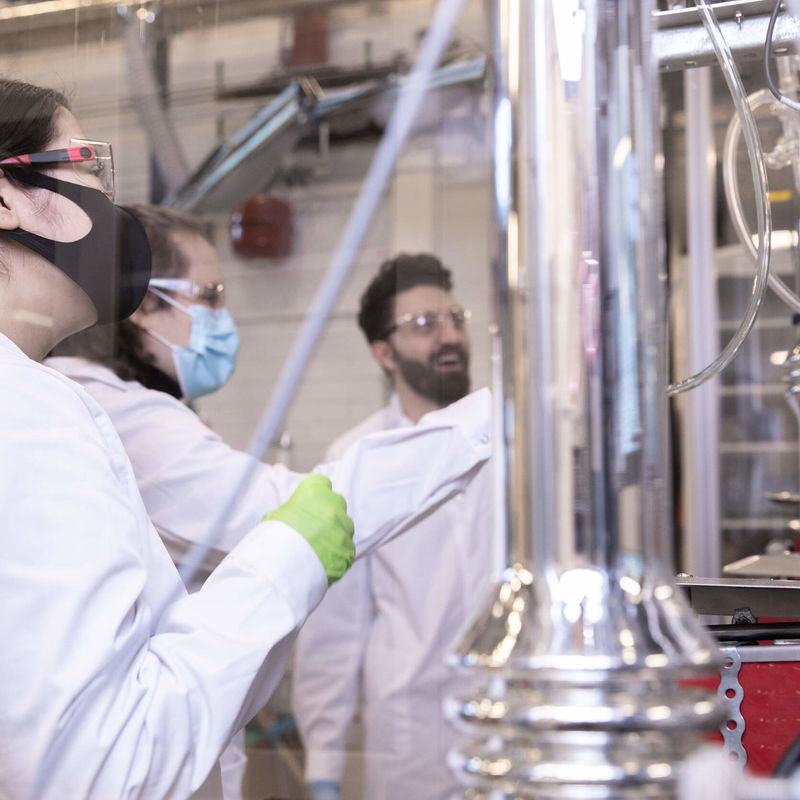 Three scientists working in a laboratory