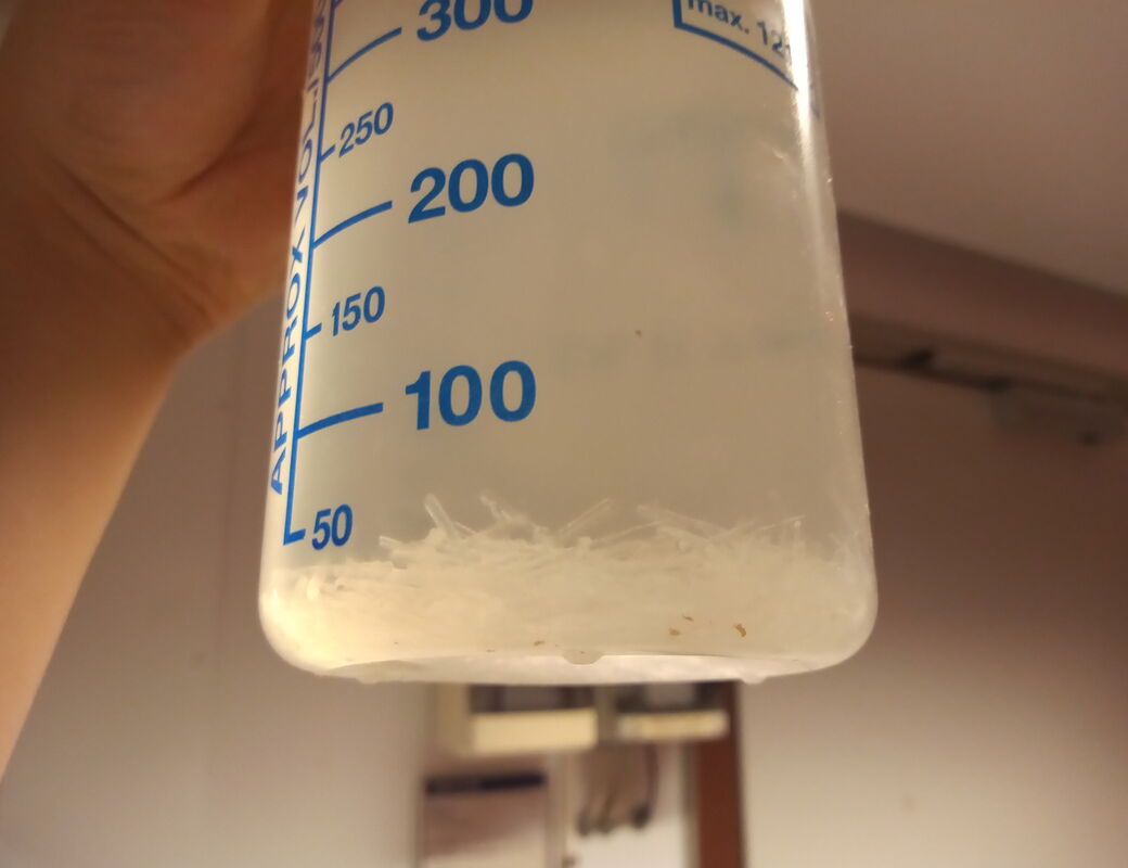 crystallized material in ammonia salt