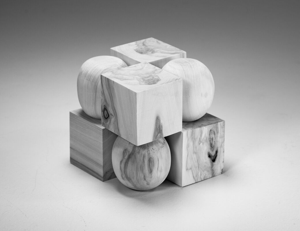 wood cube consisting of alternating cubes and spheres