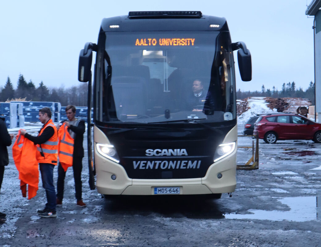 Large bus with LED letters showing words 'Aalto University'
