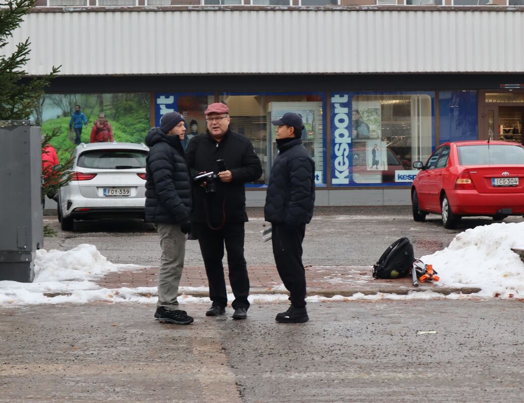 Students talking on site with local reporter