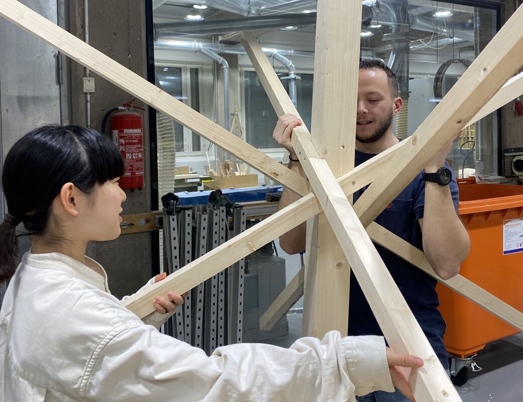 Students making mockup of wooden joint with snowflake shape