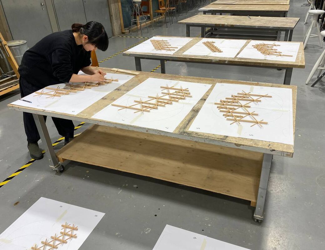 Student making scale model of the structure