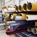 Rolls of fabric in warehouse