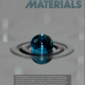 Cover of Advanced Materials journal magazine for year 2013, Vol. 25, No. 16. The background is gray. On center there is a shperical droplet dyed blue, lying on the surface of silicon. Around it there are two perfectly circular rings of water. The reflection on the Silicon surface cast their mirror image.