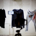 process photo of a video shoot where clothes are being tested