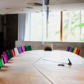 View of a meeting room with multicolored chairs in Dipoli / Photo: Aalto University, Markus Sommers