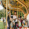 Students riding a carousel during the opening day of the semester