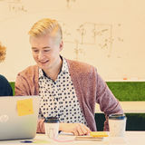 Two Aalto University students working on a laptop together / photo by Unto Rautio