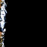 a person dressed in tin foil with black background