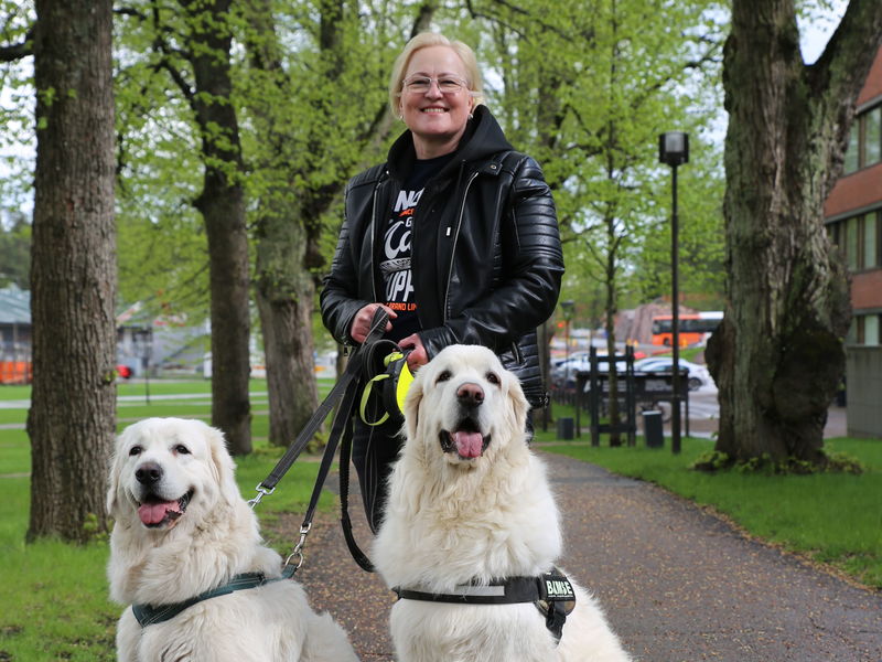 Security Manager of Aalto Riitta Gröhn with her dogs Bella and Bamse.