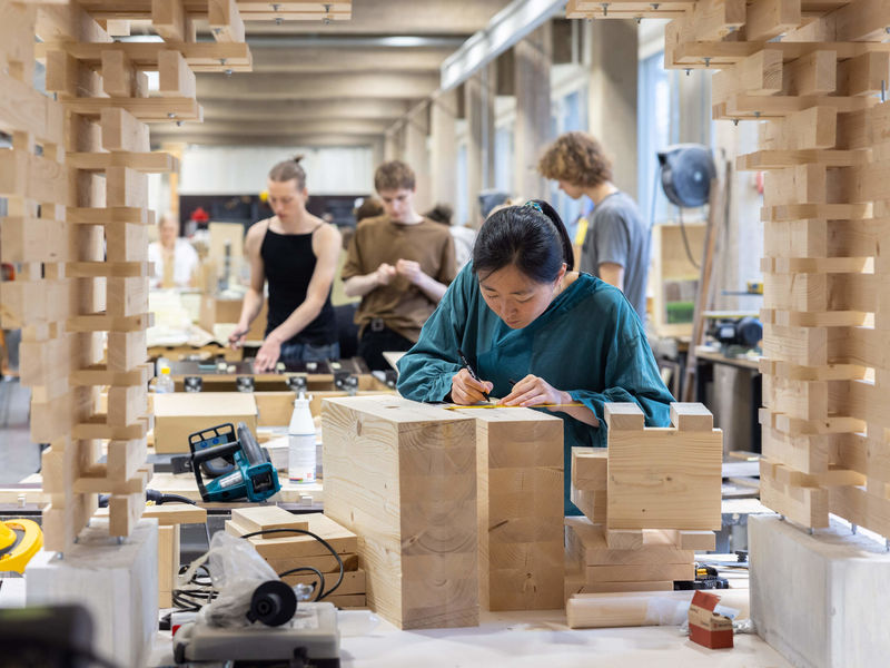 Student working on a project in a wood workshop. Photo: Mikko Raskinen / Aalto University