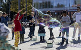 Kids making huge soap bubbles at Alvari square.