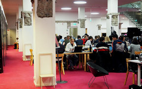 Photo from the K-floor of the Harald Herlin Learning Centre, students working at desks.