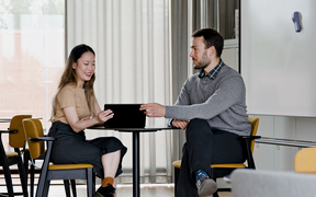A student and an assistant professor on Aalto University campus in Otaniemi