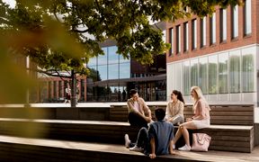 Students in front of Väre building of Aalto University campus