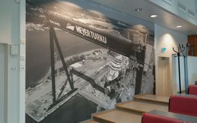 A picture of the Meyer shipyard on the wall of a company-sponsored lecture hall.