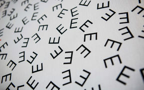 Photo of art work with letters E scattered around in different shapes