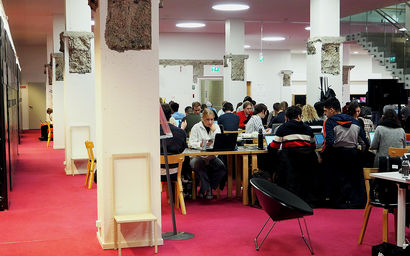 Photo from the K-floor of the Harald Herlin Learning Centre, students working at desks.