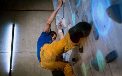 Person climbing on an augmented climbing wall