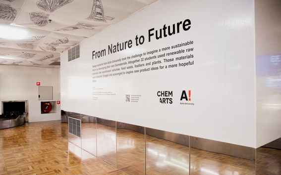 Description of the "From Nature to Future Exbition" on a white wall with black text. Photo: Eeva Suorlahti 