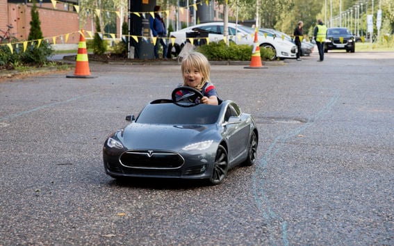 Aalto University / a kid driving a mini Tesla / photo: Annamari Tolonen