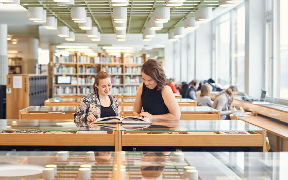 Two students at the Aalto University Learning Centre