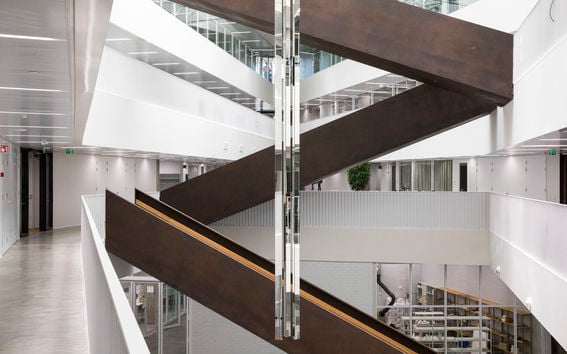Väre art works by Grönlund and Nisunen, Insight. Indoor photo of a staircase criss crossing the space with a skylight shedding light into the area.Photo: Aalto University / Mikko_Raskinen