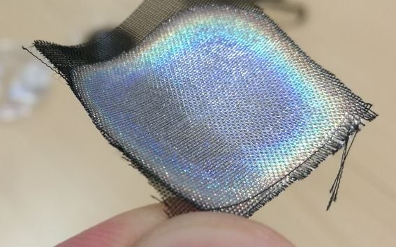 A photo demostrating the use of cellulose nanocrystals (CNC) for structural color on a piece of fabric.