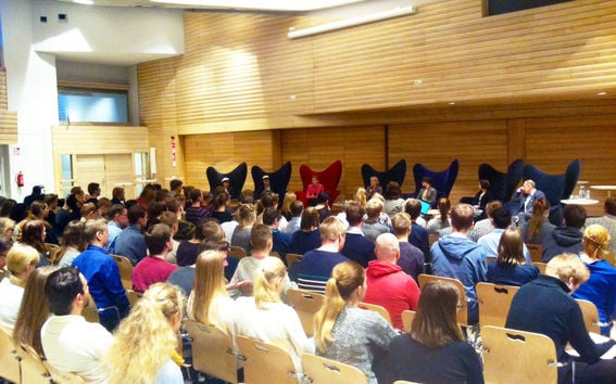 An image of students listening to panel discussion