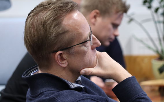Tomi Paatsila rubs his chin, sitting sideways Pic: Samuli Leppälä / Aalto University