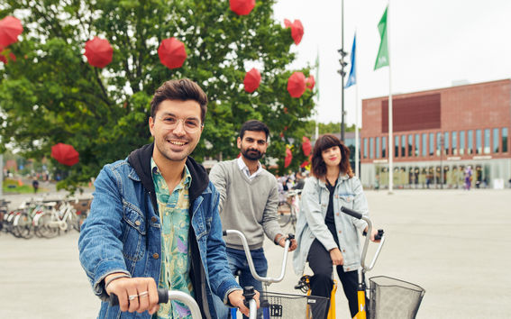 Students on bicycles on Otaniemi campus
