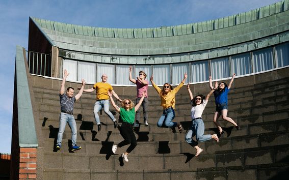 Students jumping for joy at the Amphitheater stairs.