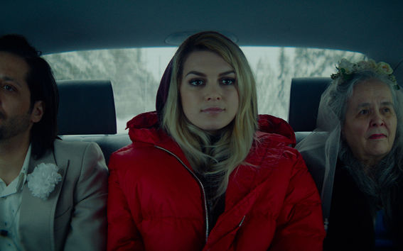 Three people sitting in a taxi