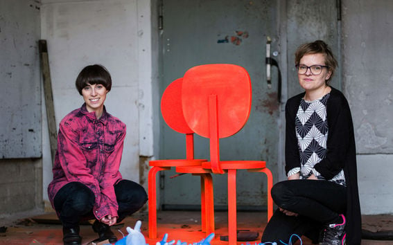 two women and chairs