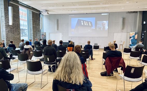 People listening to a remote talk by Jenny Osuldsen (from Norway) streamed at KYMP House as part of the Nordic CityMaking Week. 