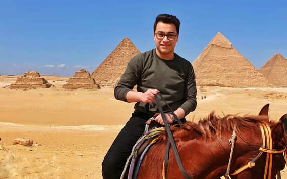 BScBA student Osama Hamoud riding a horse back home in Egypt.