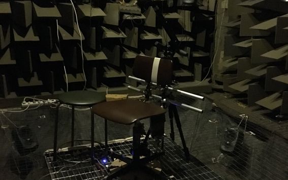 Room that was used to recreate movie theater acoustics including two chairs and speakers.