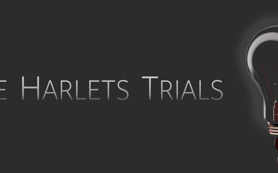 text, name of the project: The Harlets Trials and a light-bulb with dark background