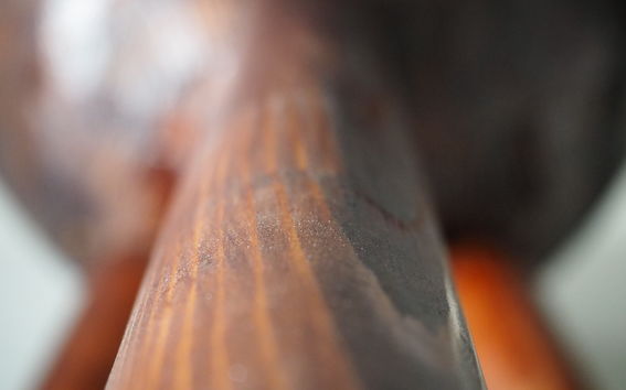 Brown lignin coating on a wood sample