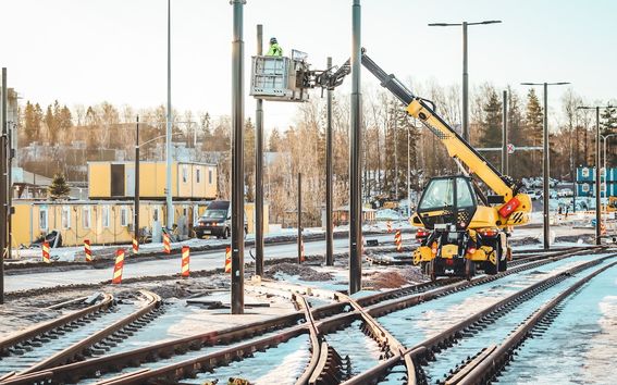 A machine fixing contact lines over tracks.